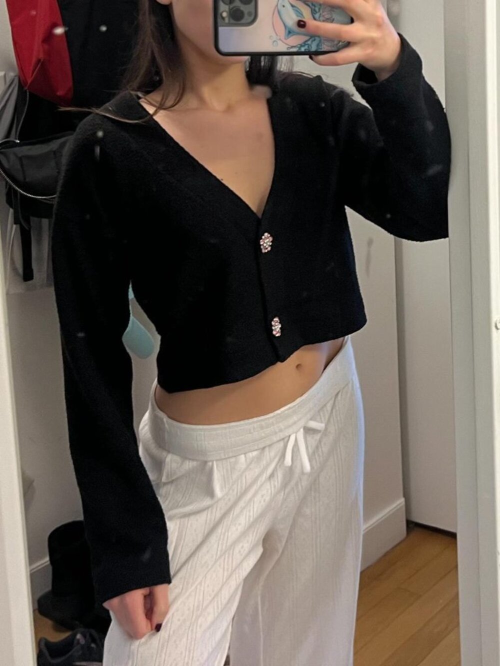 Black sweater with the cutest pink jewels for buttons. Size XS no flaws!